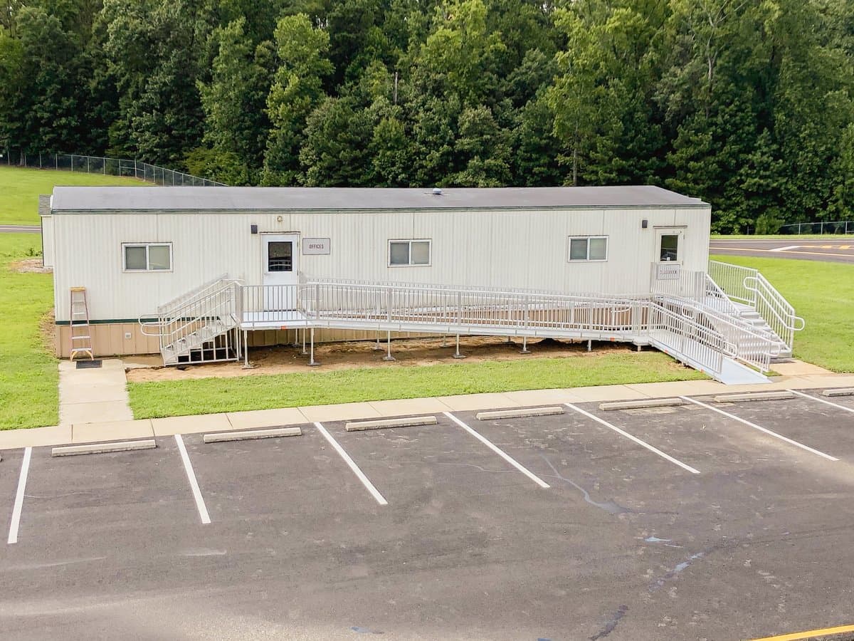 Aluminum ramp with entry platform installed at a commercial location