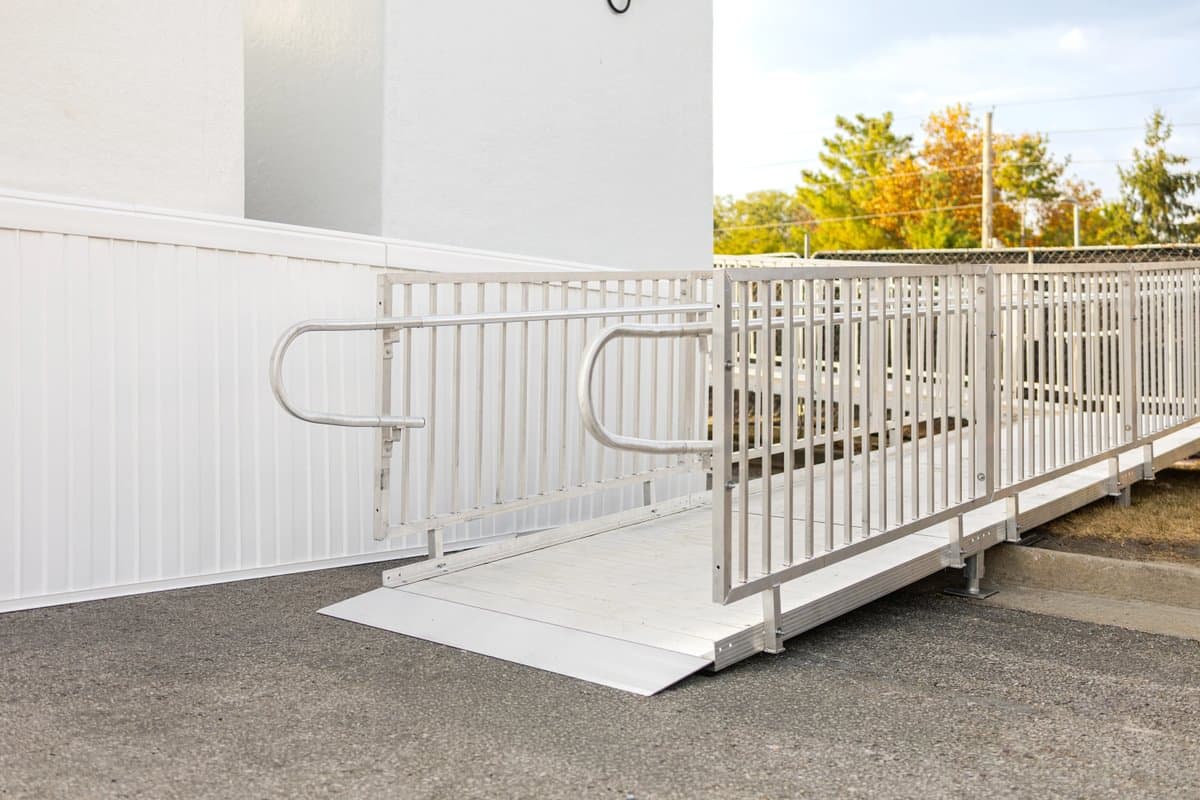 Professionally installed aluminum wheelchair ramp at a residential property