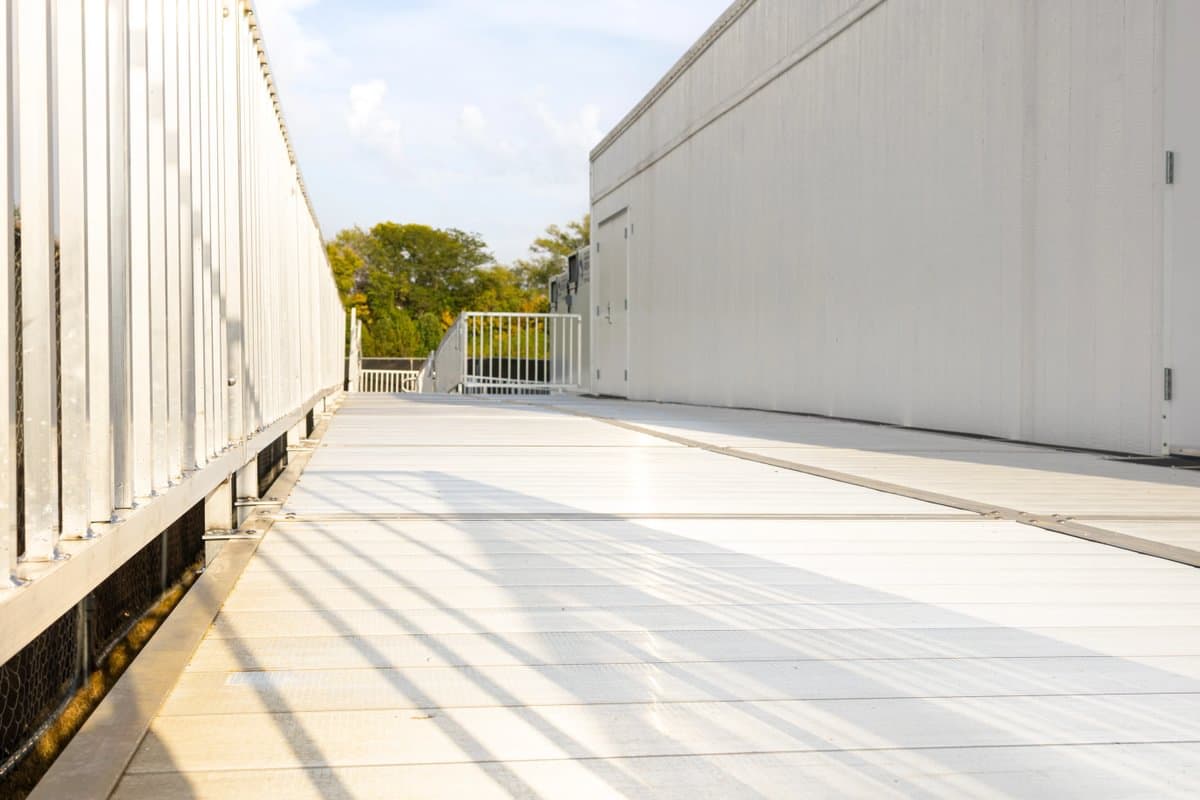Close view of Rampit USA aluminum ramp showing anti-slip tread and handrail detail