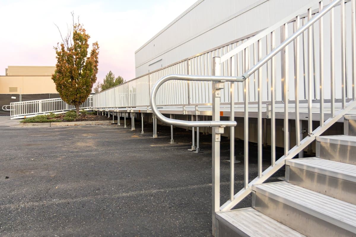 Aluminum wheelchair ramp installed at the side entry of a residential home