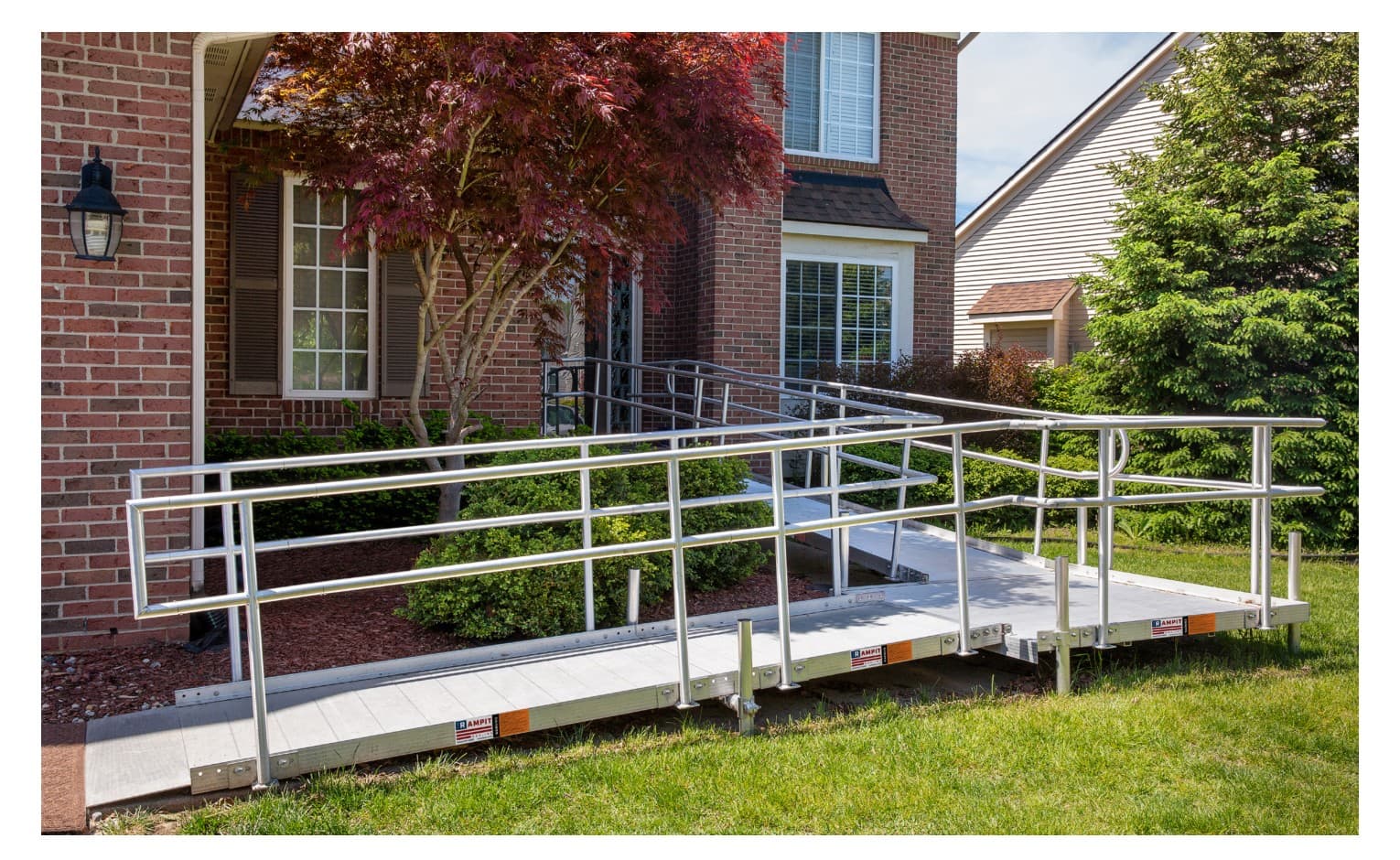 Rampit USA Independence Series aluminum wheelchair ramp installed at a brick residential home