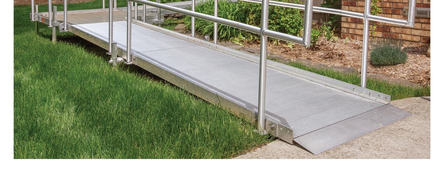 Close-up of Rampit USA aluminum ramp surface and handrails installed at a residential property