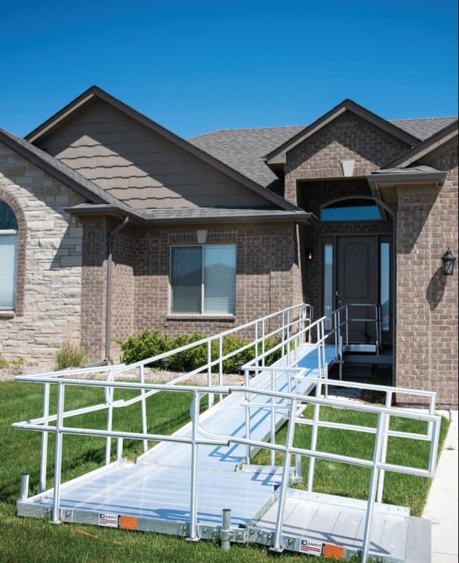 Rampit USA aluminum access ramp installed at the front entry of a brick residential home