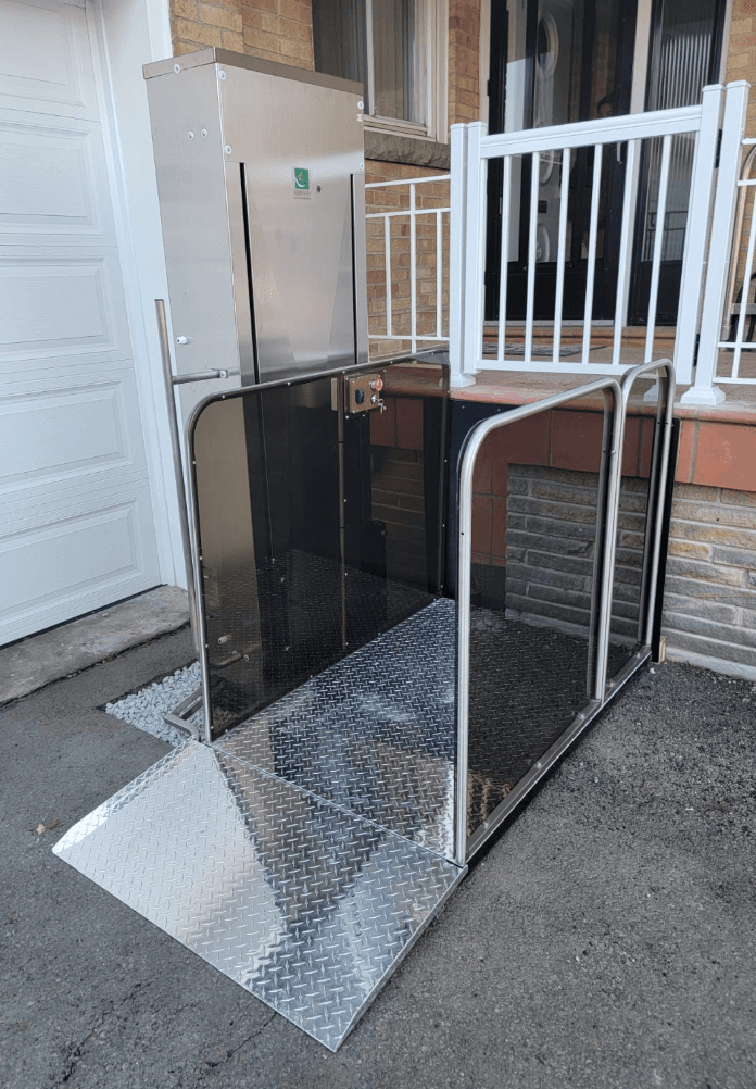 Serenity Premium wheelchair lift in stainless steel installed at a residential porch entry